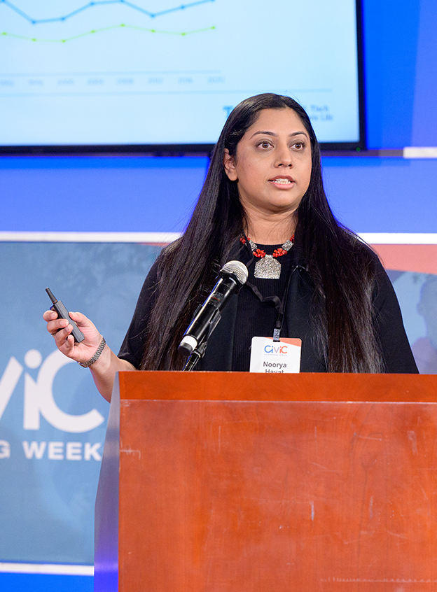 speaker behind podium presenting new research at Civic Learning Week national forum