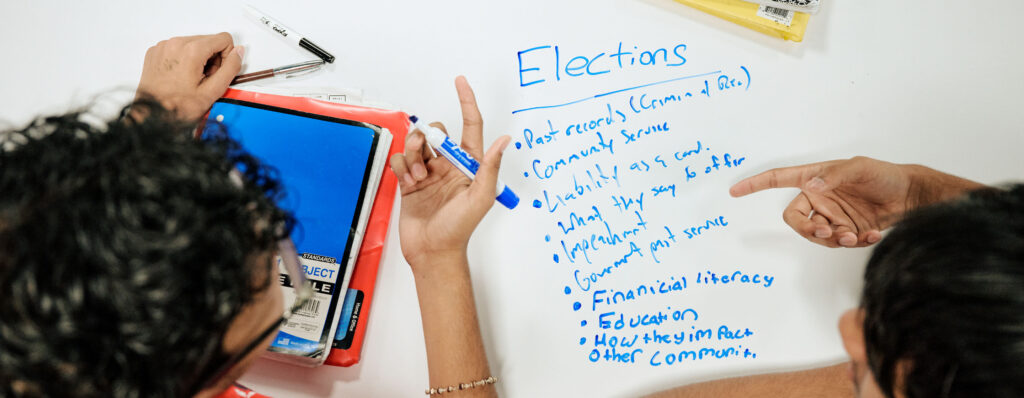 Students interacting with white board